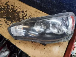  Фара левая Mitsubishi Lancer 8 Арт e10659649